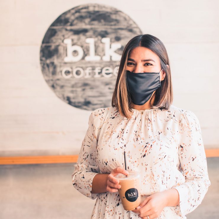 Girl with blk coffee at the Market Place in Irvine