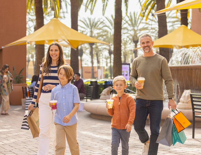 Family Shopping With Bags at The Market Place
